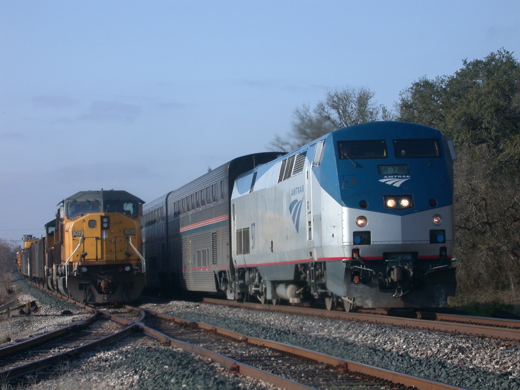AMTK 97, UP 8099  14Feb2010  NB Train 22 (Texas Eagle) in CENTEX passes UP 8099 waiting on the side in CENTEX with MOW 